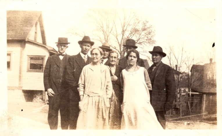 Photo of group outside house early 20th century