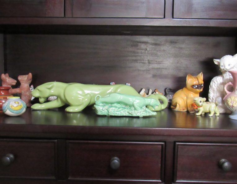 Photo of collectible figurines, mostly cats